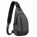 Sac bandoulière 18 x 8 x 32 cm en matière synthétique gris foncé noir à fermeture zippée style urbain